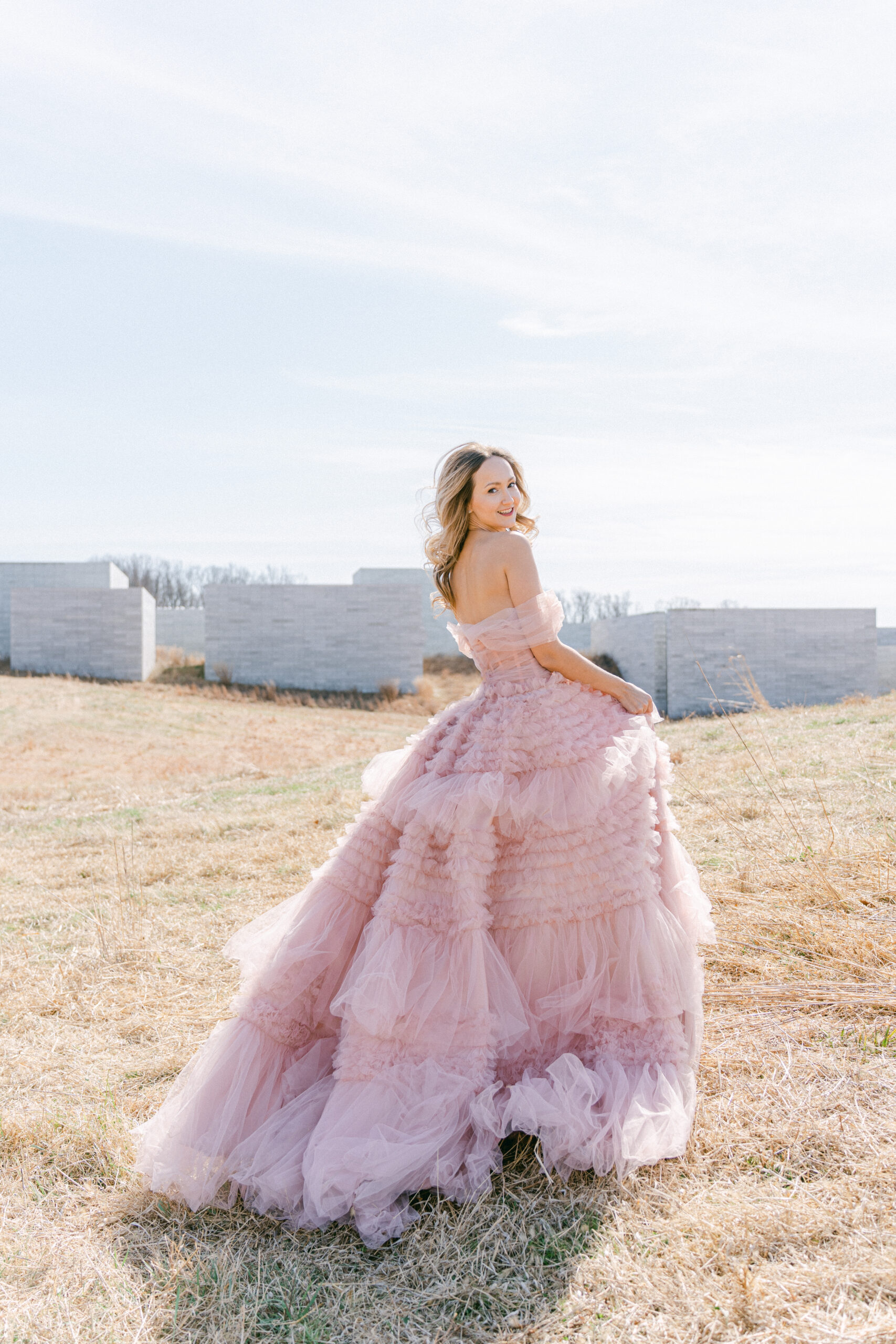 bride in couture light pink fluffy dress